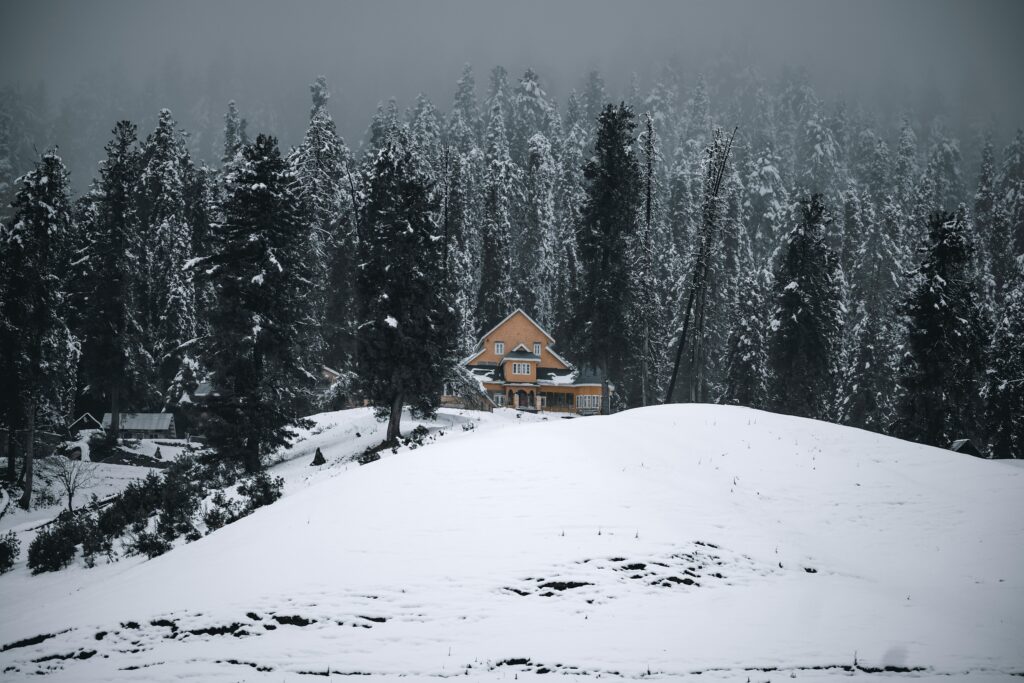 House in Mountains in Winter