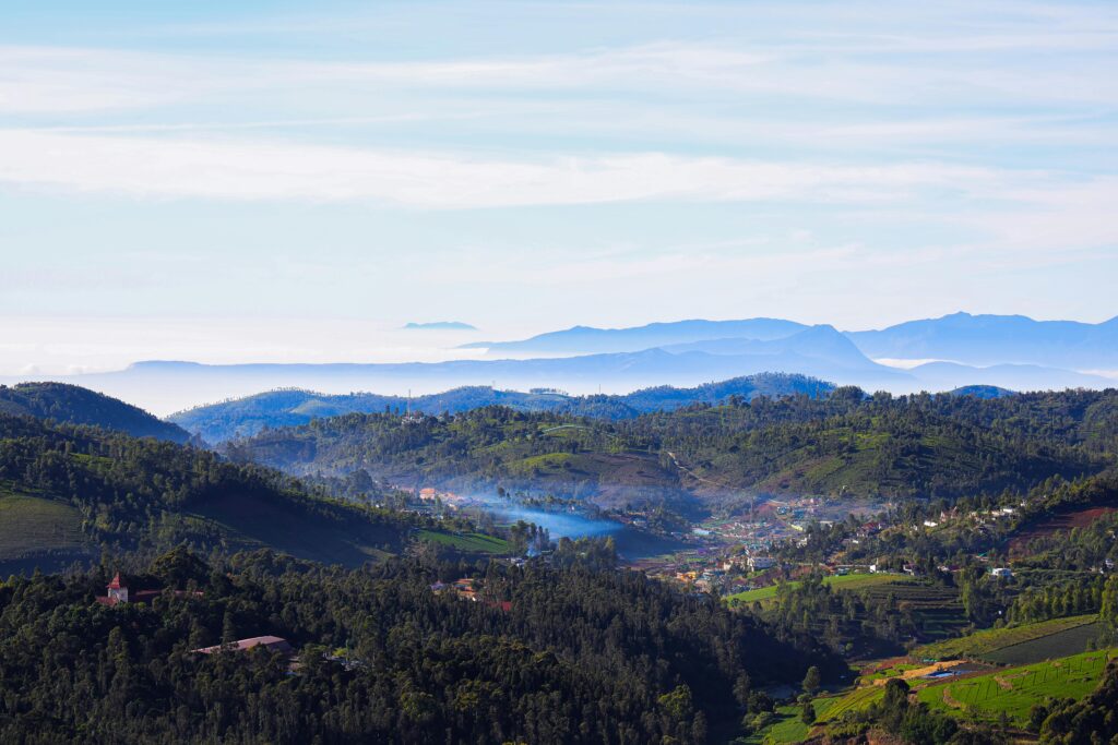 A breathtaking aerial capture of Ooty's lush green hills and serene landscape.