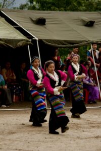 Women perform a traditional dance at a cultural event in Yuksom, India.